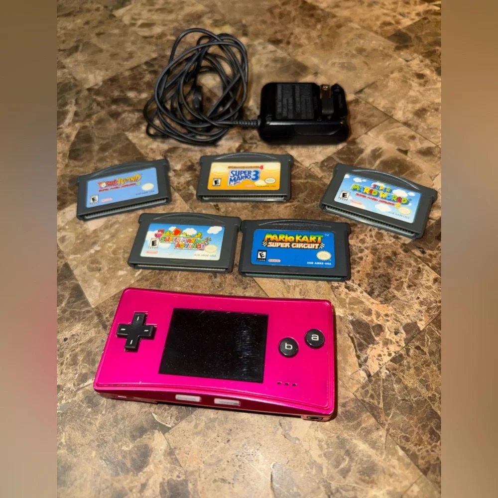 Pink Handheld Nintendo gameboy Micro with 5 games Mario Yoshi charger